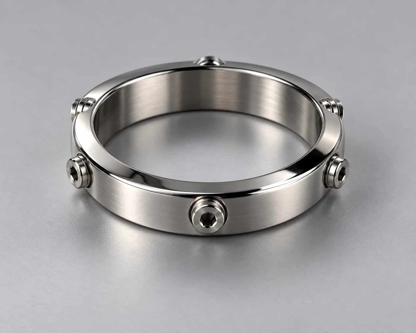 Create a tasteful, non-explicit product photograph of a polished stainless-steel ring with six small removable adjustment screws clearly visible aroun...